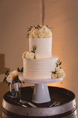 White cake with bavarian cream filling and white buttercream icing (flowers from Delford West)