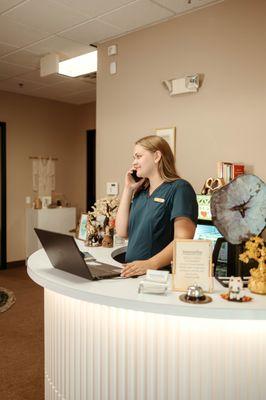 Anah working at the front desk