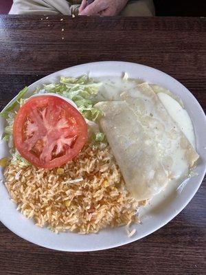 Cheese and chicken enchiladas lunch plate.