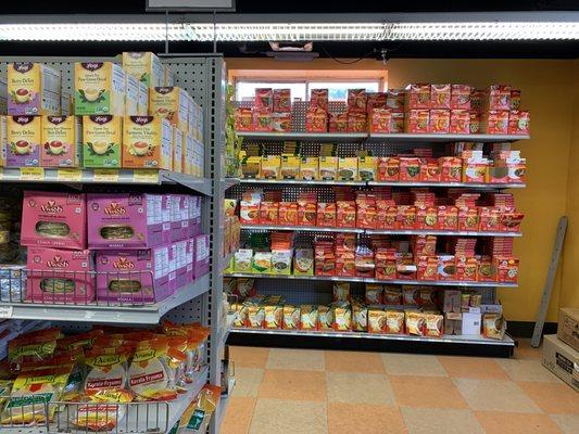 The shelves are full of grocery, beauty products and spices.