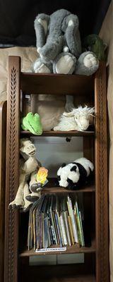 Stuffed puppets & animals to check out above children books