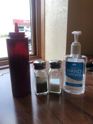 Ketchup paired with a delicious salt and pepper shaker garnish, topped off with tangy hand sanitizer. Delicious!