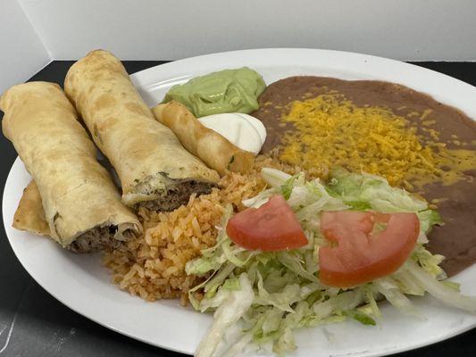 #19 combination plate flautas with beans and rice guacamole and sour cream