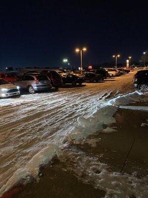 Parking lot.  2 days after the storm and it's still a slick mess.   Even the quality of the snow removal went down