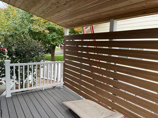 Covered deck with privacy wall.