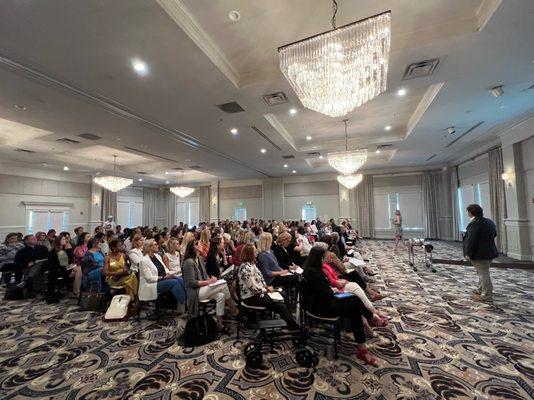 Lesley and Andy Peters educating 200+ local real estate agents on the Metro Atlanta Real Estate Market