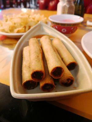 Lumpias in a boat.