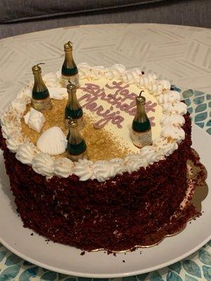 Red Velvet cake with cream cheese frosting and champagne candles!  Nailed it!