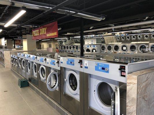 Interior photo with 39 washing machines and 44 dryers