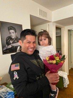 Adam and his daughter delivering flowers on saturday to a hospice patient.