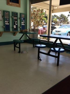 Tables and benches inside while you wait.