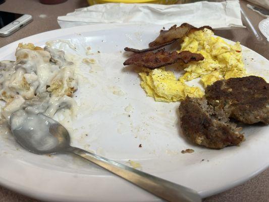 half eaten gravy biscuit (little beaver approved), scrambled eggs, bacon, and sausage.  Sausage was very good-homemade and NOT pre-pattied