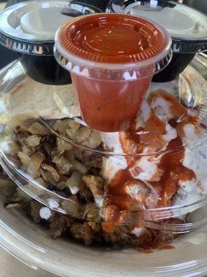 Mixed gyro platter with sauté onions, rice and salad