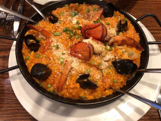 Ancora 's Original Paella for two.  One split lobster tail, 8 mussels, 4 large shrimp and Spanish rice seasoned with hot peppers and pork.