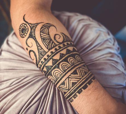 Men get temporary tattoos too! Check out this fun jagua tattoo that will last up to two weeks!