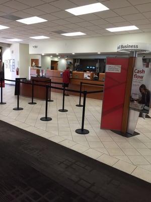 Teller line without anyone in line. Big banks need to downsize brick and mortar branches. Who goes to a branch these days?