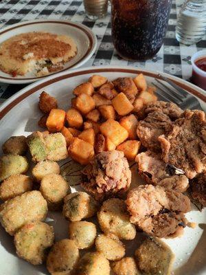 Chicken livers, fried okra, skillet potatoes, and a hoe cake.