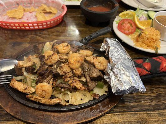 Steak, chicken, and shrimp fajitas