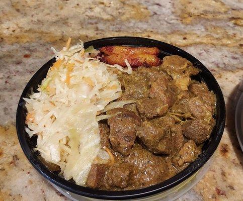 Curry Goat with Rice and Peas ,Cabbage and Plantain.