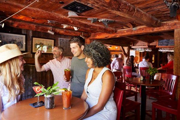 The Red Mill Restaurant- Group Enjoying Drinks & Darts