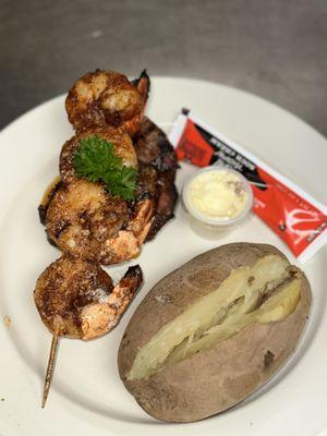 Filet with grilled blackened shrimp and a baked potato