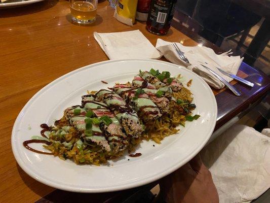 Tuna steak over fried rice.