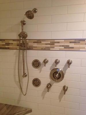 Shower remodel includes 4 body sprays and 3 shower heads