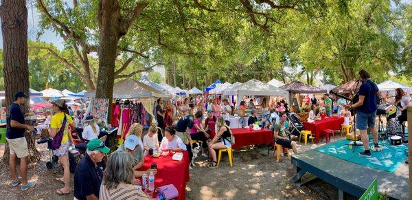 A panoramic photo of the market on a beautiful spring day.