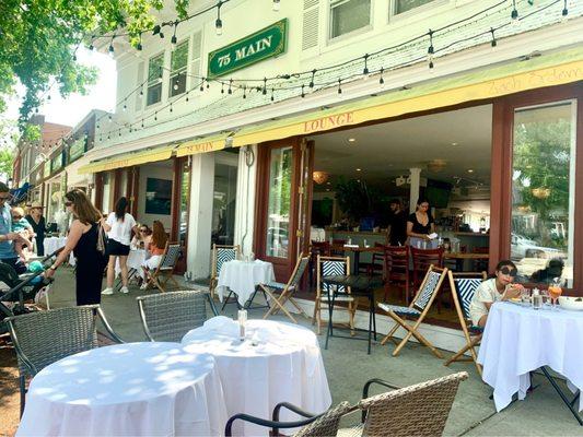 Very popular outside seating area. Nicely shaded at lunchtime. Doors are wide open for some inside seating to feel part of the outside