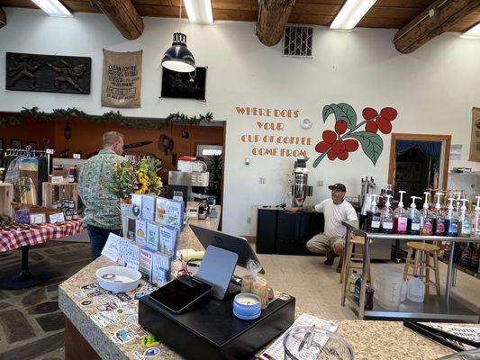 Justin showing my husband the coffee roaster.