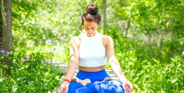 Padmasana (full lotus yoga asana) in Kishwaketoe Nature Preserve, Williams Bay, WI