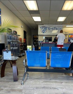 Stylish Blue Clean Seating and Phone Charging Station on Coffee Stand.