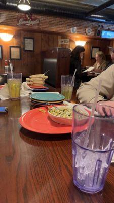 My table with bowls, plates and empty drinks that sat for over 15 minutes .