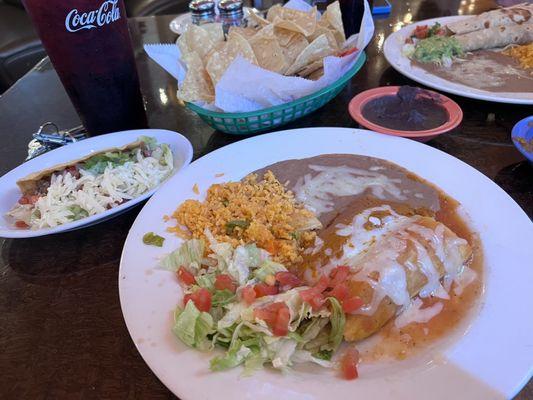 Pictured is Tres Amigos combo plate and beef Tacos Al Carbon plate on the far right.