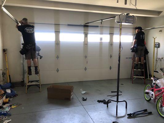 Brian and Jason hard at work installing new garage door.