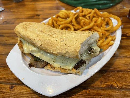 Philly Cheesesteak and curly fries