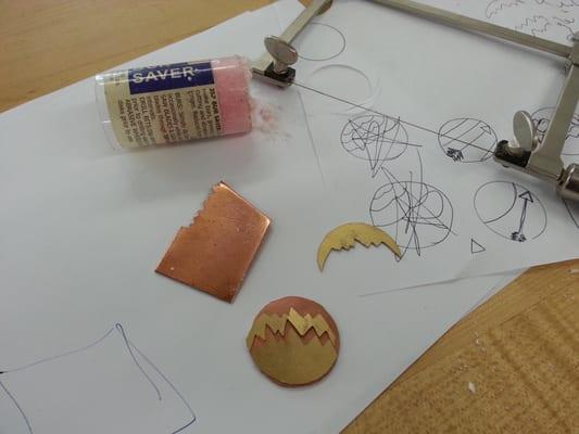 Making a brass and Cooper pendant.