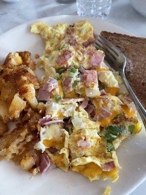 Western omelette with home fries and whole wheat toast