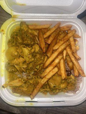 Curry chicken with rice & peas and fries