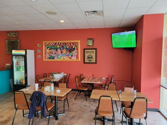 Large eating area and TV screens. Very clean eating and food preparation areas.