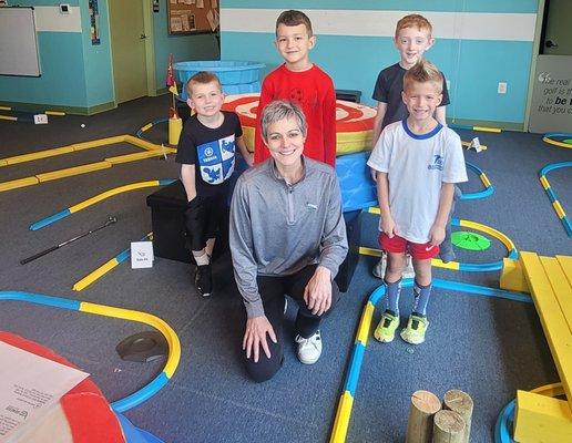 Coach Kim with students from a Beginner Golf Class.