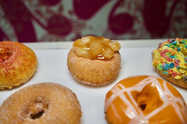 The JIMBO. A cinnamon sugar rolled donut with Apple Pie Filling and a Caramel Drizzle. Always made to order!