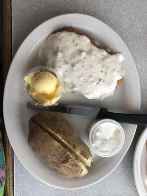 Country Fried Steak and Baked Potato with Butter and Sour Cream