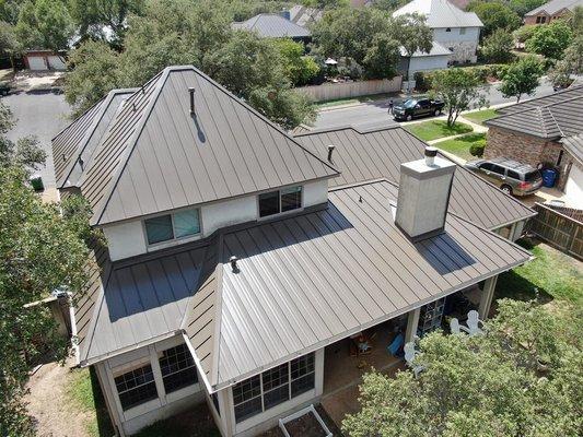 Standing seam metal roofing. Medium bronze color