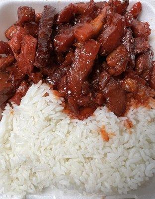 BBQ Pork and steamed rice. Very red BBQ Pork from food coloring.