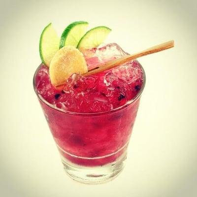 Made with Ketle One, cranberry juice and a splash of soda!  Garnish with slivers  of lime and orange.