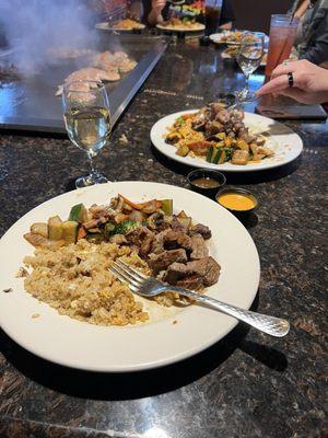 Fried rice, steak and vegetables.