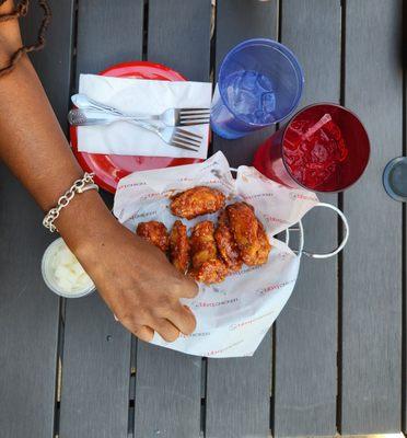 Signature sauced chicken wings.