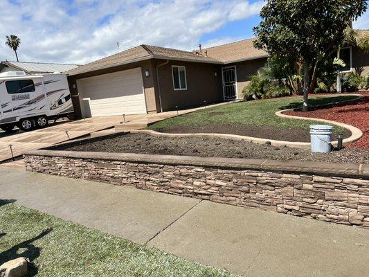 Veneer stacked stone planter wall with a precast cap done in Ventura, Ca.