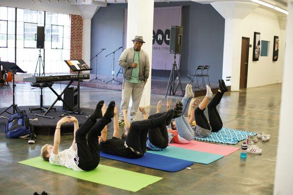 Working on breathing techniques with the Kidz Bop kids.